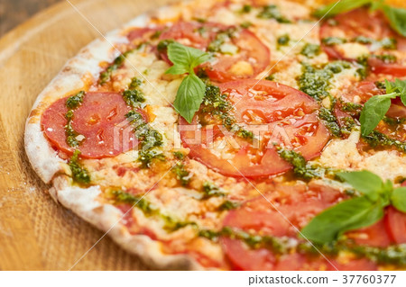 Thin Crust Tomato Pizza, close up. Thin Crust Tomato Pizza, close up. 37760377