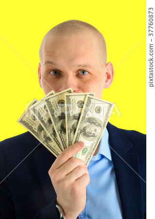 Happy handsome man in a suit holding fan of dollar 37760873