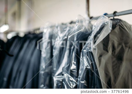 Clothes on hangers, sewing factory or dress fabric 37761496