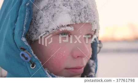A teenager in winter Park, face closeup . The time A teenager in winter Park, face closeup . The time 37761798