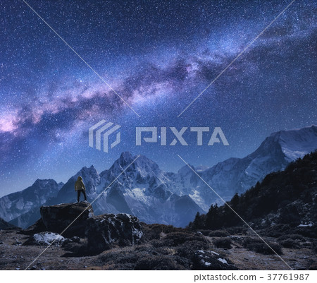 Space with Milky Way, man and mountains 37761987