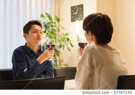 Middle couple drinking wine Middle couple drinking wine 37767249