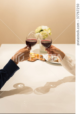 Toast with wine (hand up) Toast with wine (hand up) 37767250