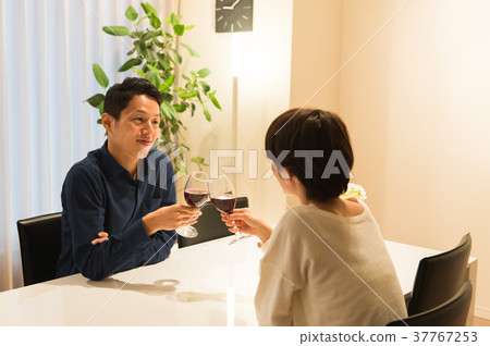 Middle couple drinking wine Middle couple drinking wine 37767253