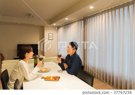 Middle couple drinking wine Middle couple drinking wine 37767256