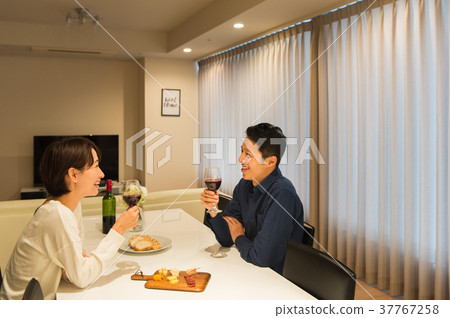 Middle couple drinking wine Middle couple drinking wine 37767258