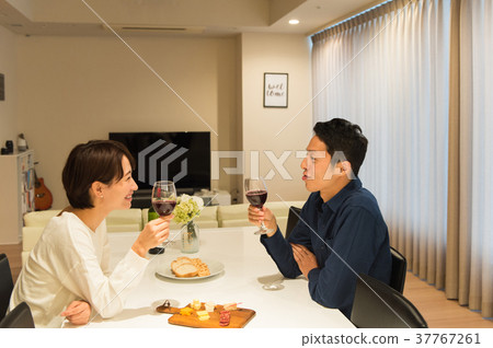 Middle couple drinking wine Middle couple drinking wine 37767261