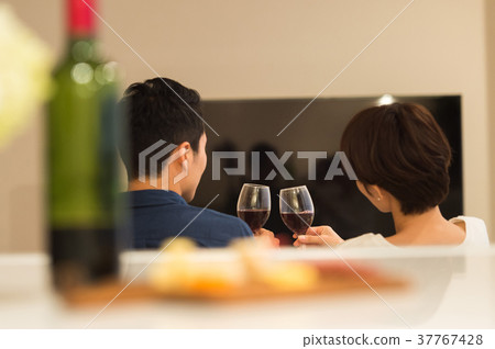 Middle couple relaxing on the sofa Middle couple relaxing on the sofa 37767428