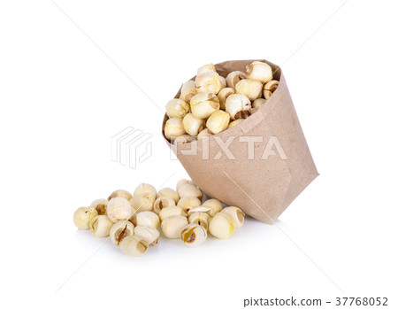 dried lotus seeds in paper bag and on white dried lotus seeds in paper bag and on white 37768052