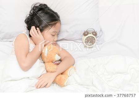 cute girl sleep and hug trddy bear doll 37768757