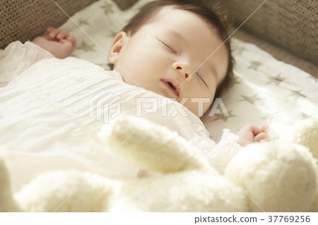 Sleeping baby on the couch Sleeping baby on the couch 37769256