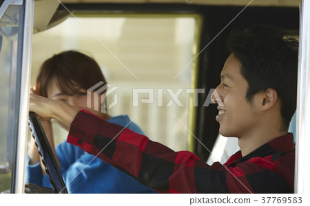 A couple driving 37769583