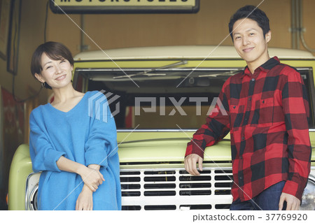 Married couple relaxing outdoors Married couple relaxing outdoors 37769920