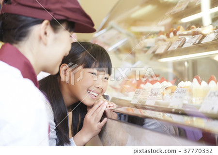 A kid who came to buy a cake A kid who came to buy a cake 37770332
