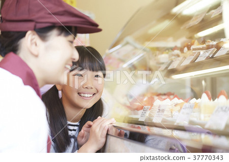 A kid who came to buy a cake A kid who came to buy a cake 37770343