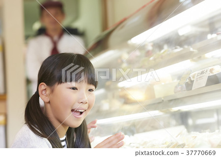 A kid who came to buy a cake A kid who came to buy a cake 37770669
