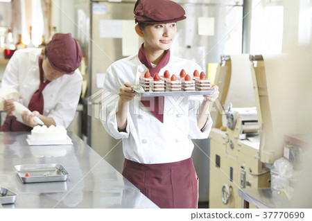 Woman doing part-time job at a cake shop Woman doing part-time job at a cake shop 37770690