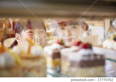 A kid who came to buy a cake A kid who came to buy a cake 37770762
