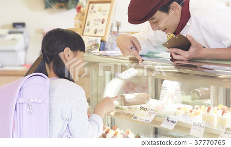 A kid who came to buy a cake A kid who came to buy a cake 37770765