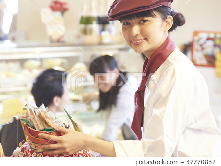 Woman doing part-time job at a cake shop 37770832