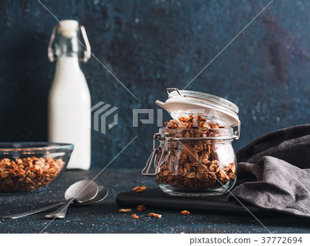 Homemade granola in glass jar on dark table 37772694