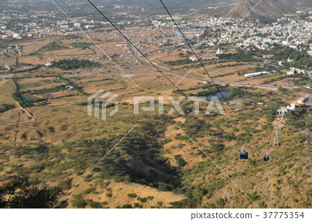 State of the camel festival and the cityscape seen from Hindu temple at the peak of Pushkar peak in India Ropeway to climb the peak State of the camel festival and the cityscape seen from Hindu temple at the peak of Pushkar peak in India Ropeway to climb the peak 37775354