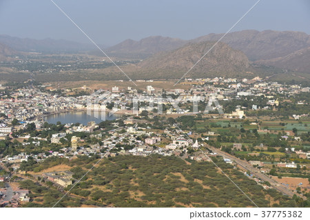 Pushkar lake and cityscape seen from Hindu temple on the peak of Pushkar mountain in India 37775382