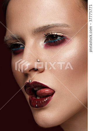 A beautiful girl with art creative make-up and A beautiful girl with art creative make-up and 37775771
