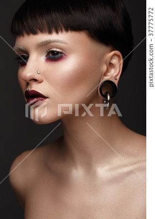 A beautiful girl with art creative make-up and 37775772