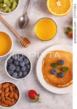 Pancakes with fruit, honey, nuts. Pancakes with fruit, honey, nuts. 37775961