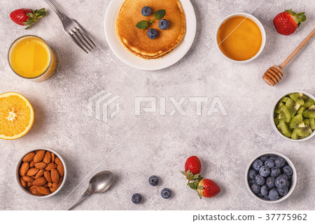 Pancakes with fruit, honey, nuts. Pancakes with fruit, honey, nuts. 37775962