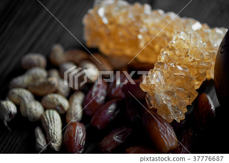 Brown grape sugar in transparent crystals.Eastern Brown grape sugar in transparent crystals.Eastern 37776687