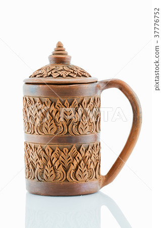 Antique grunge sculptured clay cup Antique grunge sculptured clay cup 37776752
