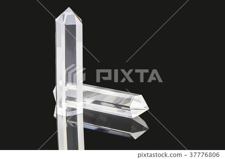 Natural quartz stone on black background 37776806