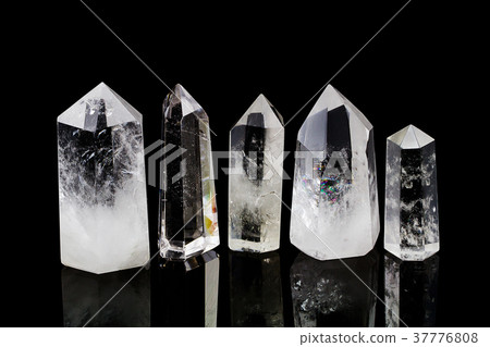 Natural quartz stone on black background 37776808