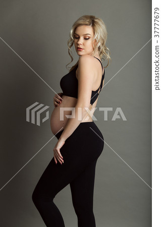Pregnant beautiful blonde woman is wearing 37777679
