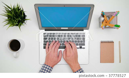 A Man's Hands Typing on the Laptop A Man's Hands Typing on the Laptop 37778527