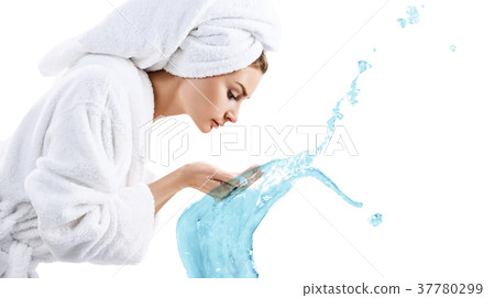 Young woman washing face with clean water. Young woman washing face with clean water. 37780299