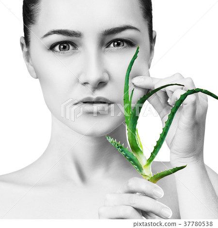 Woman with aloe vera plant and perfect skin. 37780538