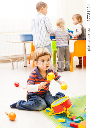 Kids playing with toys Kids playing with toys 37781424