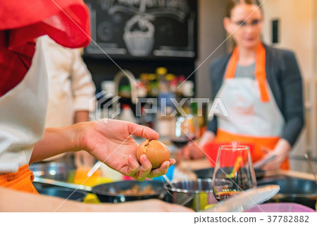 Female hands hold cracked egg 37782882
