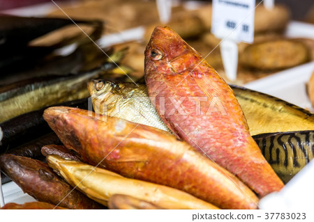 Whole smoked fish in supermarket 37783023