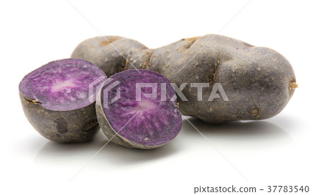 Fresh vitelotte potato isolated on white 37783540