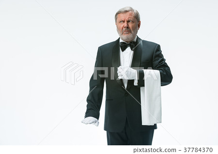 Senior waiter holding white towel 37784370