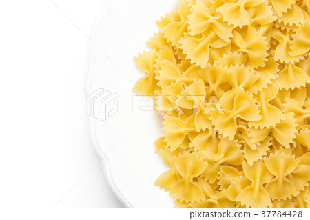 Raw fresh farfalle isolated on white Raw fresh farfalle isolated on white 37784428