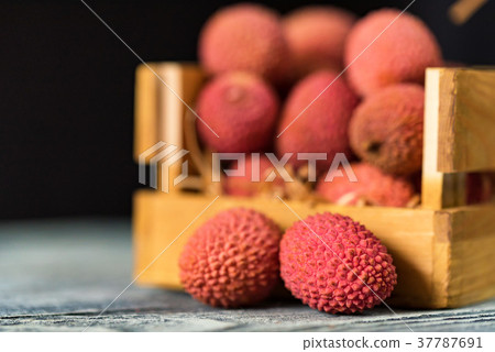 Lychee fruit in wooden box close 37787691