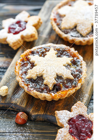 Cakes with dried fruits, orange jam and nuts. 37789457