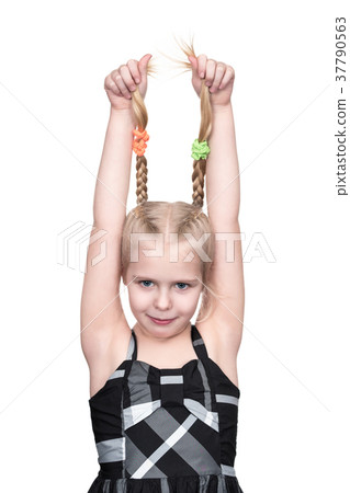 Girl is holding her pigtails Girl is holding her pigtails 37790563