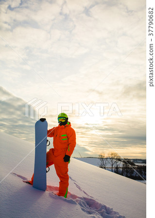 Snowboarder at the background of sunset Snowboarder at the background of sunset 37790682