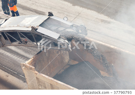 Road works. Asphalt removing machine loading Road works. Asphalt removing machine loading 37790793